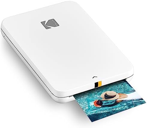 Imprimante photo couleur mobile instantanée KODAK Step Slim - Imprimez sans fil des photos 2x3" sur du papier Zink avec des appareils iOS et Android, blanc
 Fiche Technique et Prix au Maroc